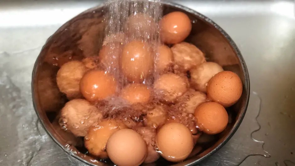 When boiling Easter eggs: What is added to the water so they don’t crack and peel easily?